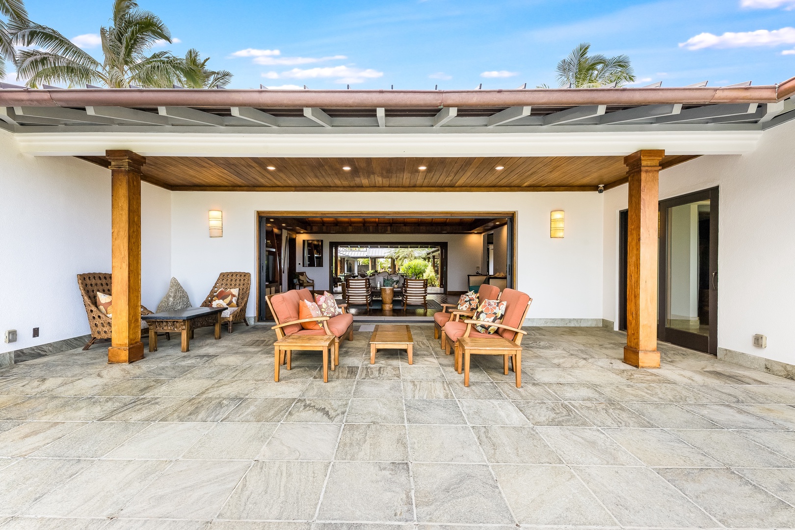 Kailua Vacation Rentals, Castle Point Estate - Elegant stone terrace with lounge seating for effortless indoor-outdoor living.