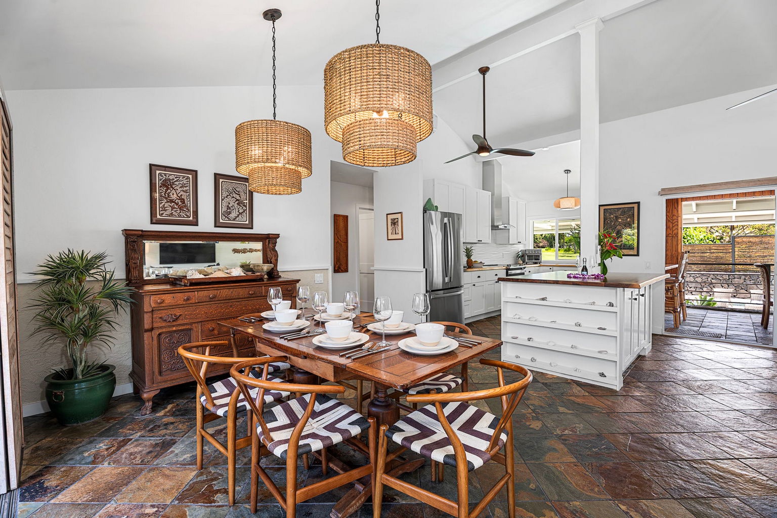 Kailua Kona Vacation Rentals, Manukai Hale - A woven pendant hangs over the table where the open plan keeps everyone together.