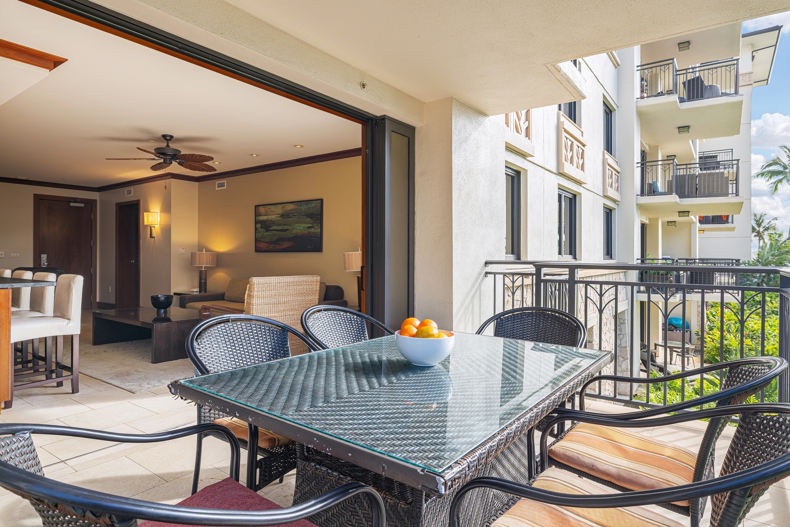 Step onto your private balcony with outdoor dining for six, perfect for morning coffee or tropical sunset meals while soaking in the warm island breeze and courtyard views.