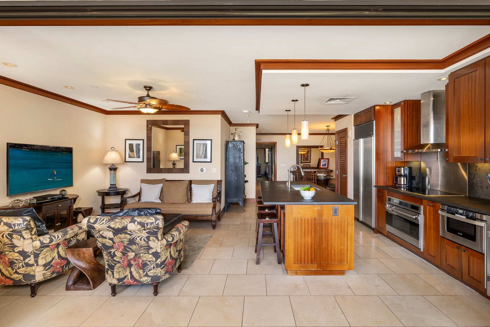 Kapolei Vacation Rentals, Ko Olina Beach Villas O805 - Looking at the open concept plan with seamless connection between the dining, kitchen and living areas.