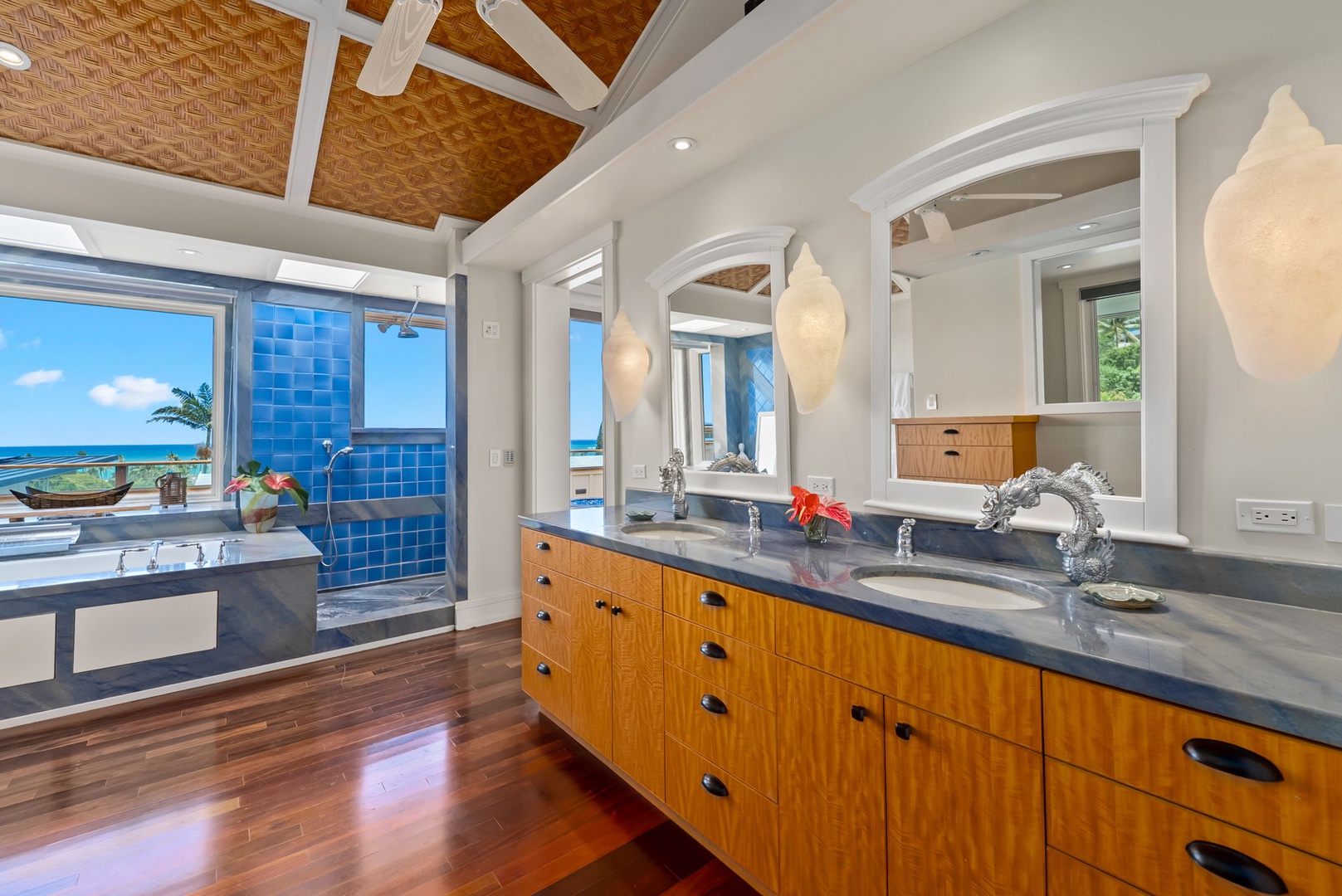 Kailua Vacation Rentals, Leaf House - Pamper yourself in this luxurious master bath with double vanities, elegant pendant lighting, and stunning ocean views through floor-to-ceiling windows that bring the tropical paradise right to your morning routine.