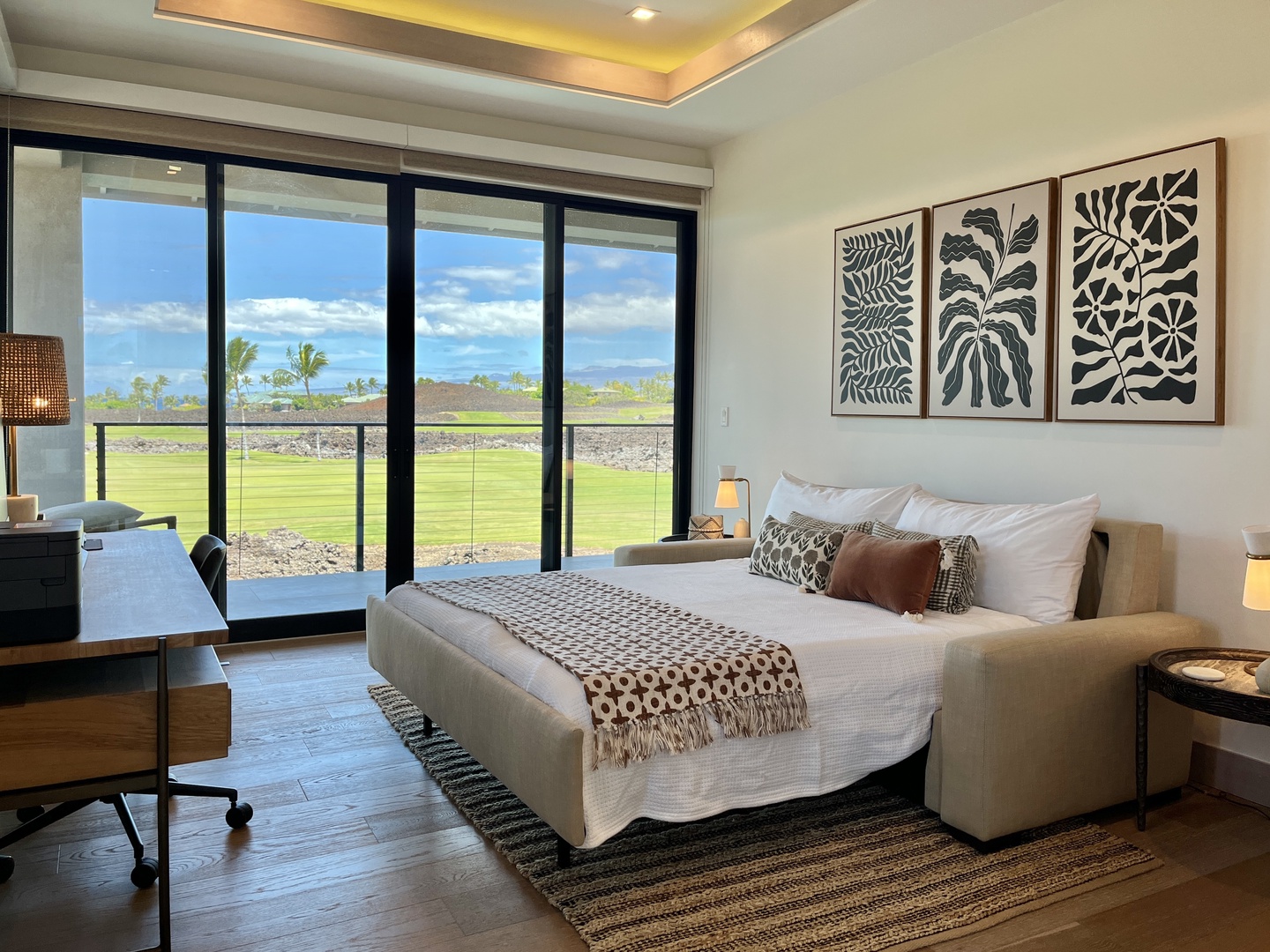 Waimea Vacation Rentals, 6BD Mauna Lani Lux Golf Estate (4) at One Ocean - Versatile room with the sofa converted into a full bed, offering comfortable accommodations alongside modern décor and private lanai views.