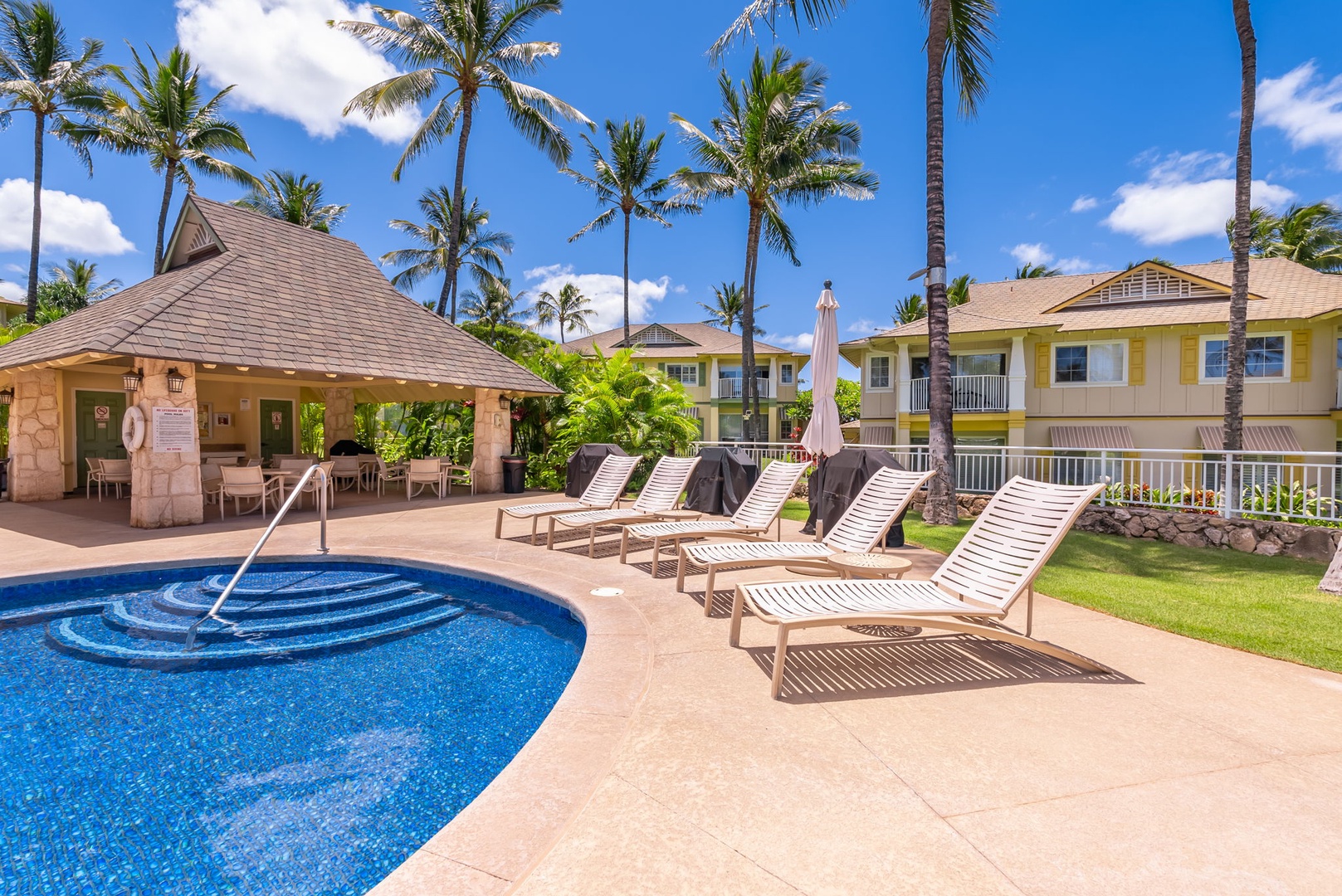 Kapolei Vacation Rentals, Kai Lani Luxury 6D - Comfortable lounge chairs by the pool, perfect for soaking up the sun or enjoying a peaceful poolside nap.