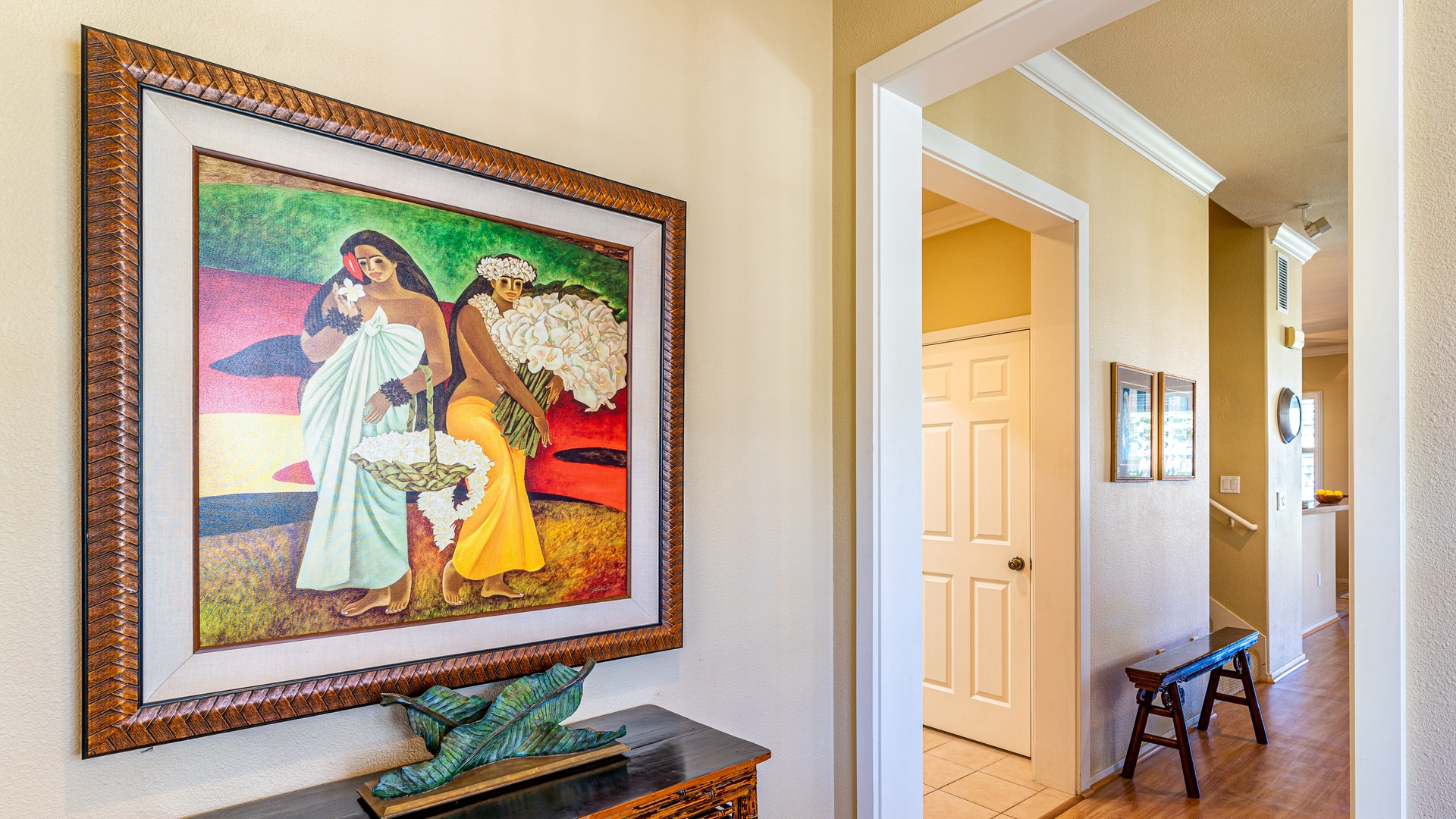 Kapolei Vacation Rentals, Coconut Plantation 1174-2 - The entry of the home with framed art.