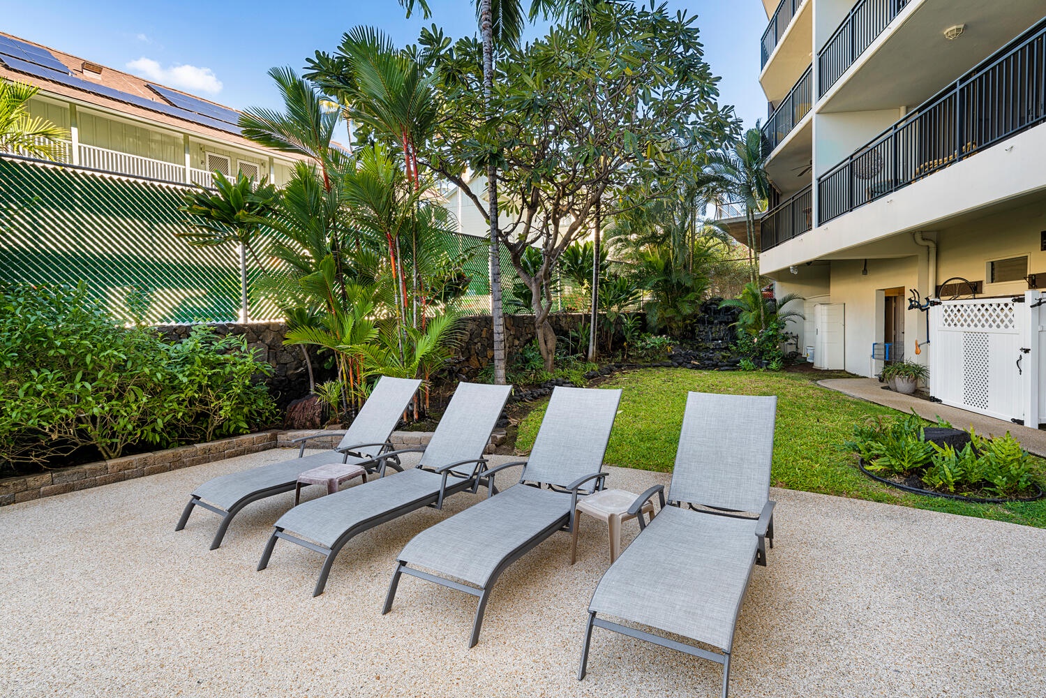 Kailua Kona Vacation Rentals, Kona Alii 302 - Poolside loungers available for swimmers.
