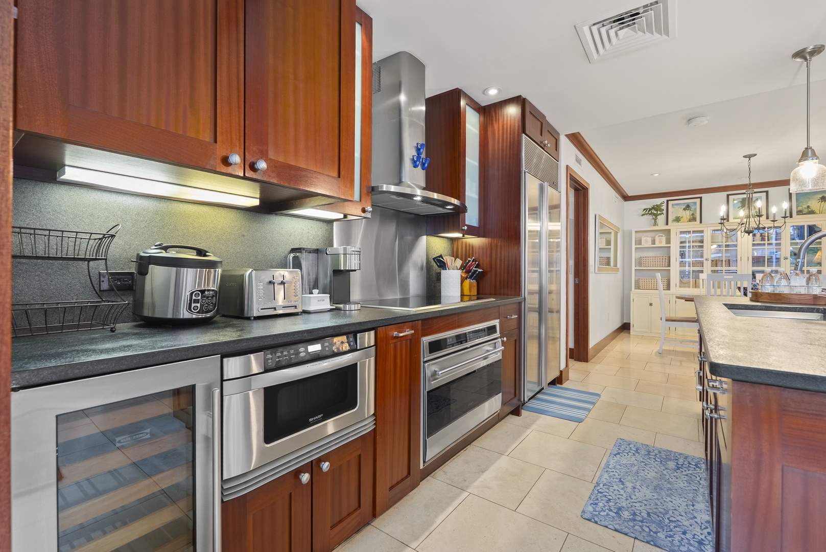 A proper range and wine fridge are ready for evenings when dinner takes center stage.
