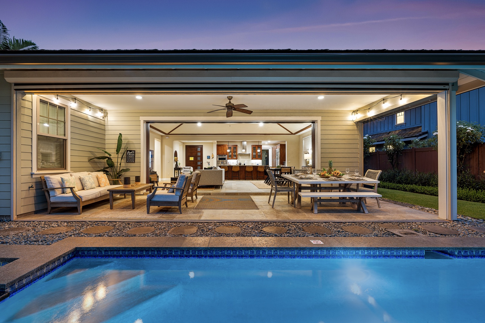 Kailua Kona Vacation Rentals, Holua Kai #27 - Lit from inside at dusk, the house holds the pool still and ready off the lanai.
