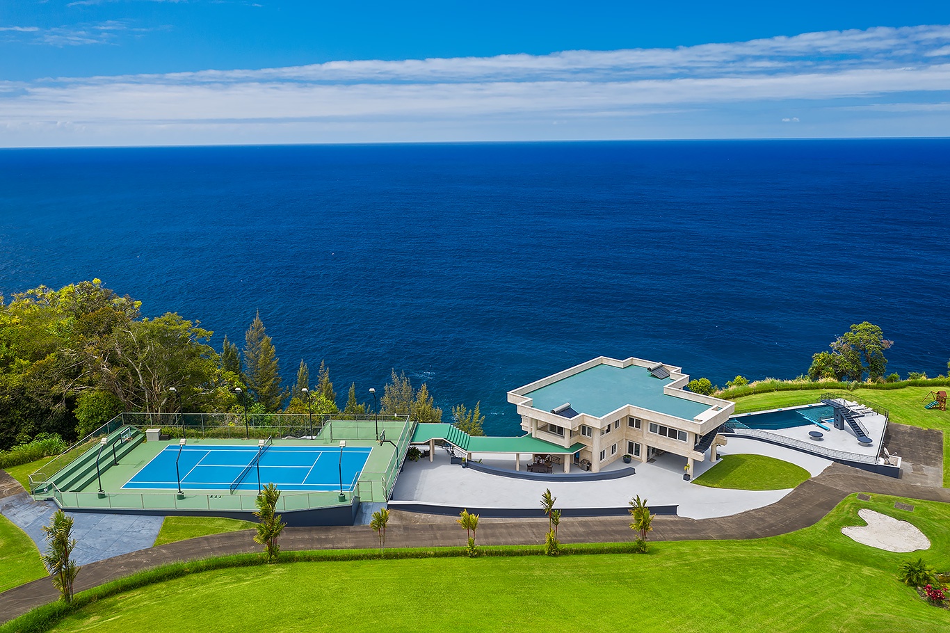 Ninole Vacation Rentals, Waterfalling Estate - Nestled clifftop on Big Island’s breathtaking Hamakua Coast.