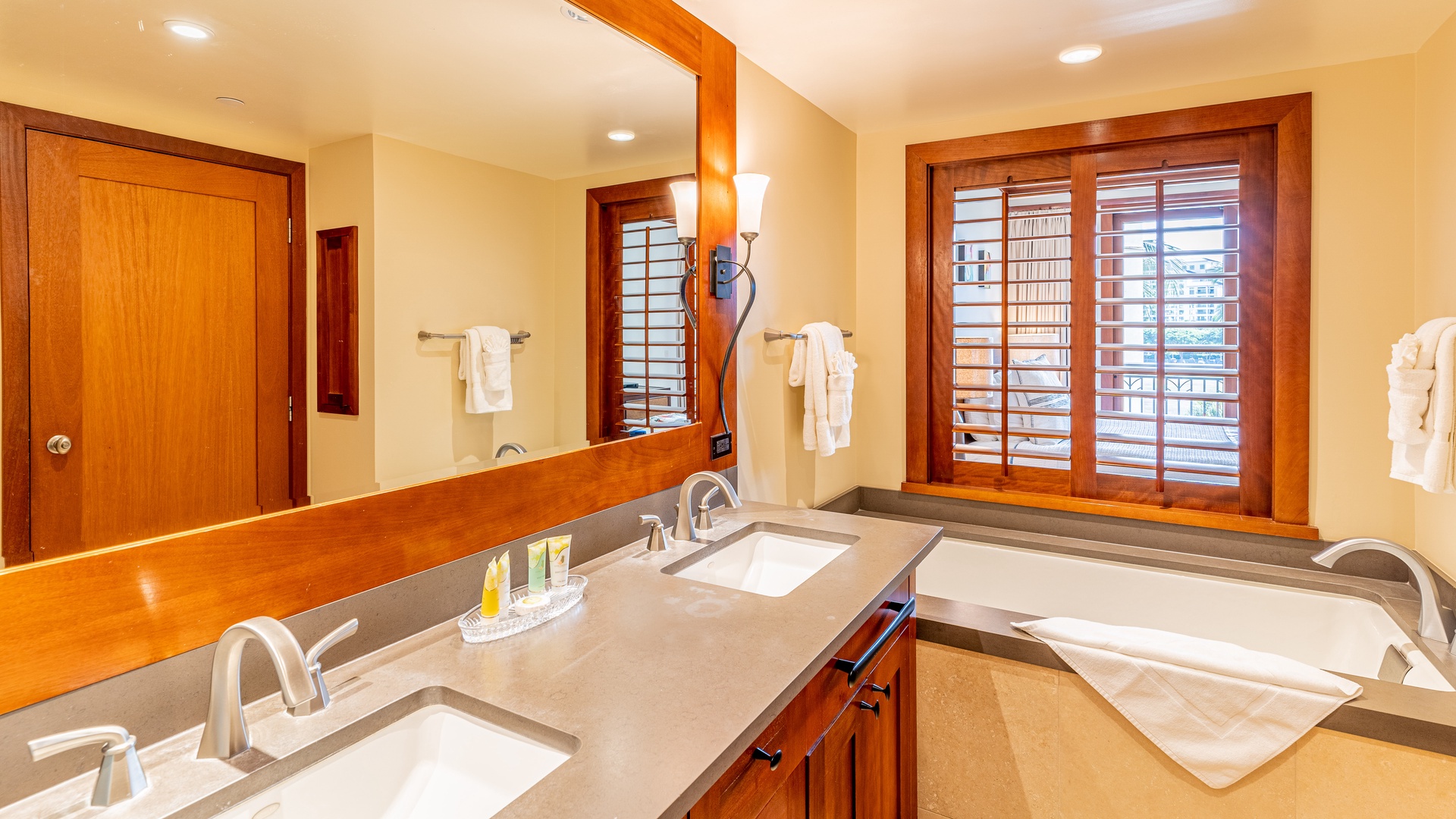 Kapolei Vacation Rentals, Ko Olina Beach Villas B403 - The primary guest bathroom with a luxurious soaking tub.