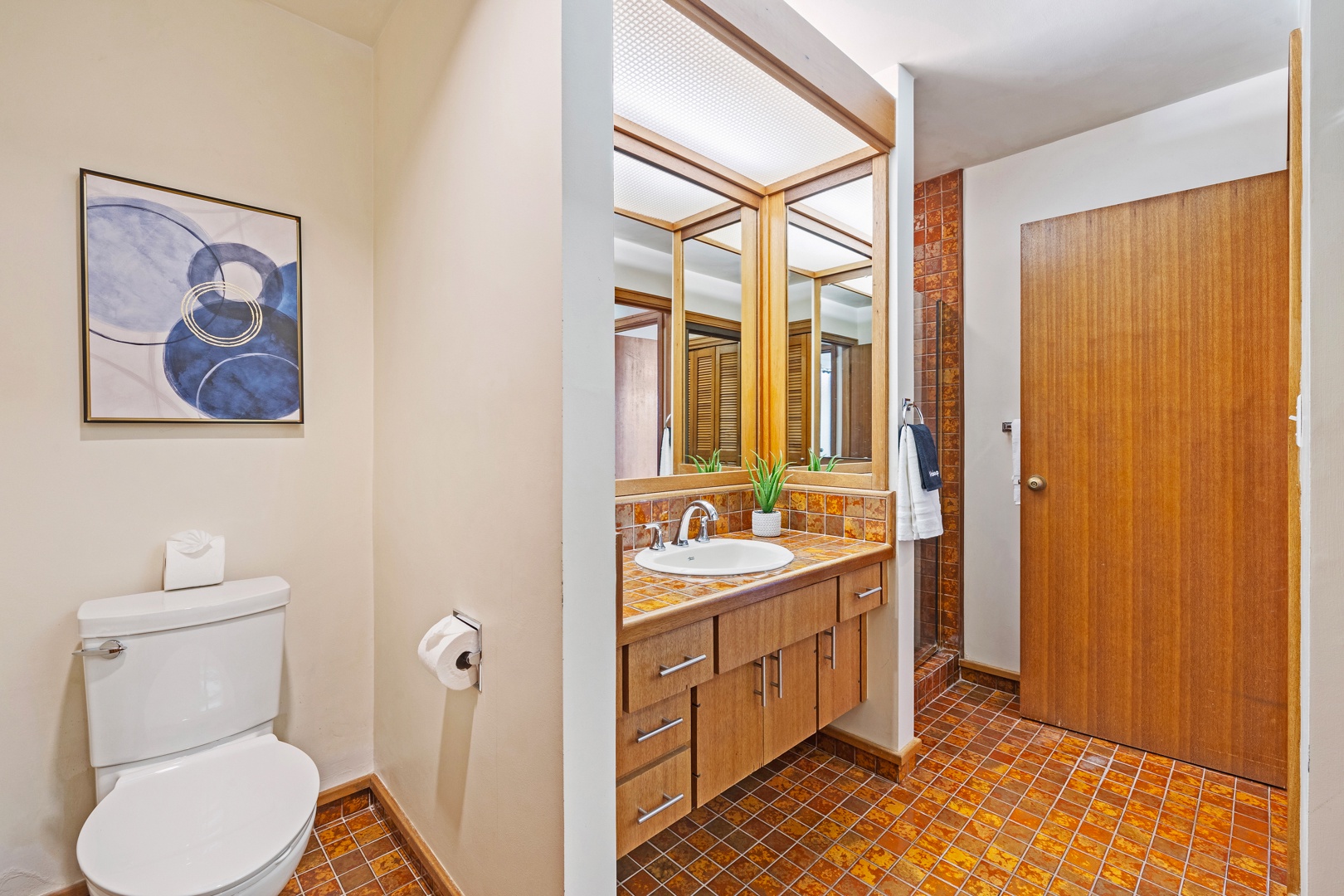 Lahaina Vacation Rentals, Kapalua Ridge 2321 - The ensuite bath at Kapalua Ridge 2321 showcases vintage tilework and a walk-in shower.