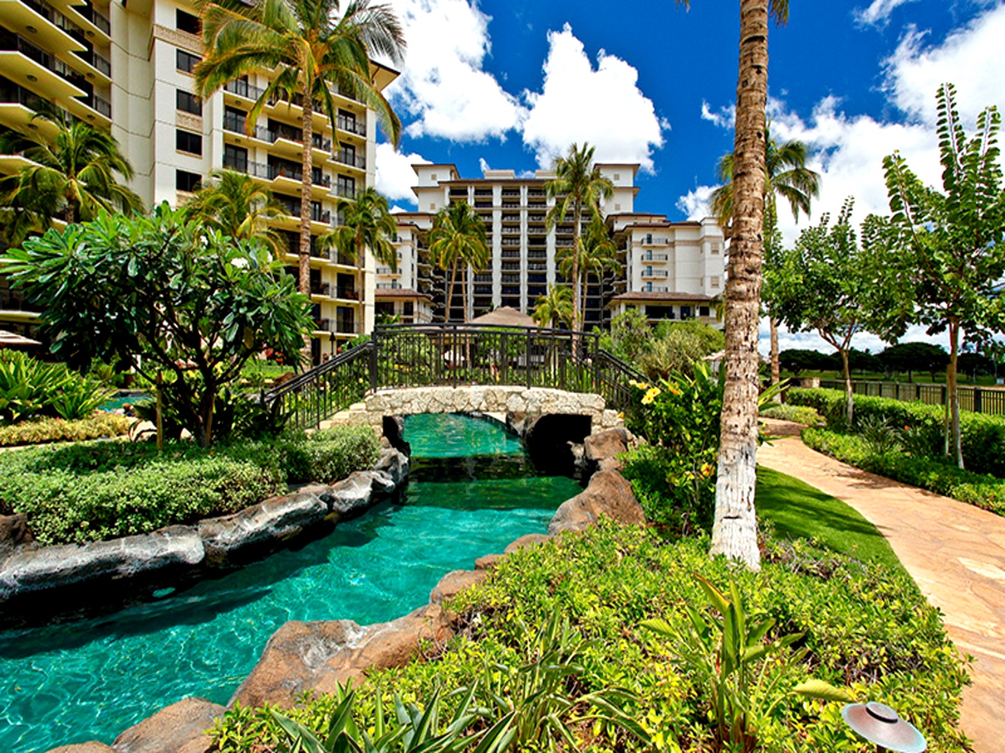 Kapolei Vacation Rentals, Ko Olina Beach Villas O1004 - Enchanting landscapes around the pool for a reflective stroll.