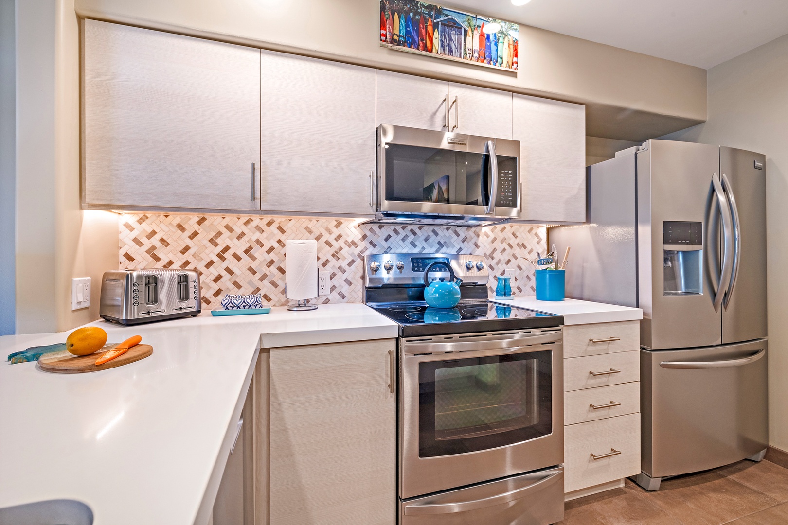 Lahaina Vacation Rentals, Kaanapali Royal Q-202 - The kitchen features stainless steel appliances and plentiful storage options.