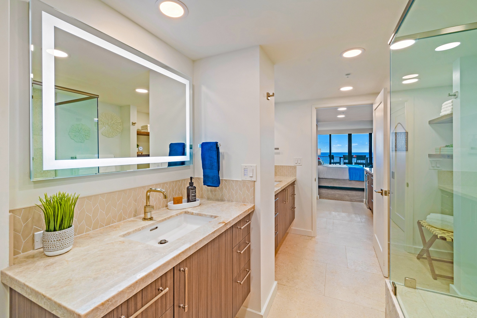 Lahaina Vacation Rentals, Kaanapali Shores 702 - The spacious bathroom features a dual-sink vanity with elegant lighting, perfect for getting ready with ease.