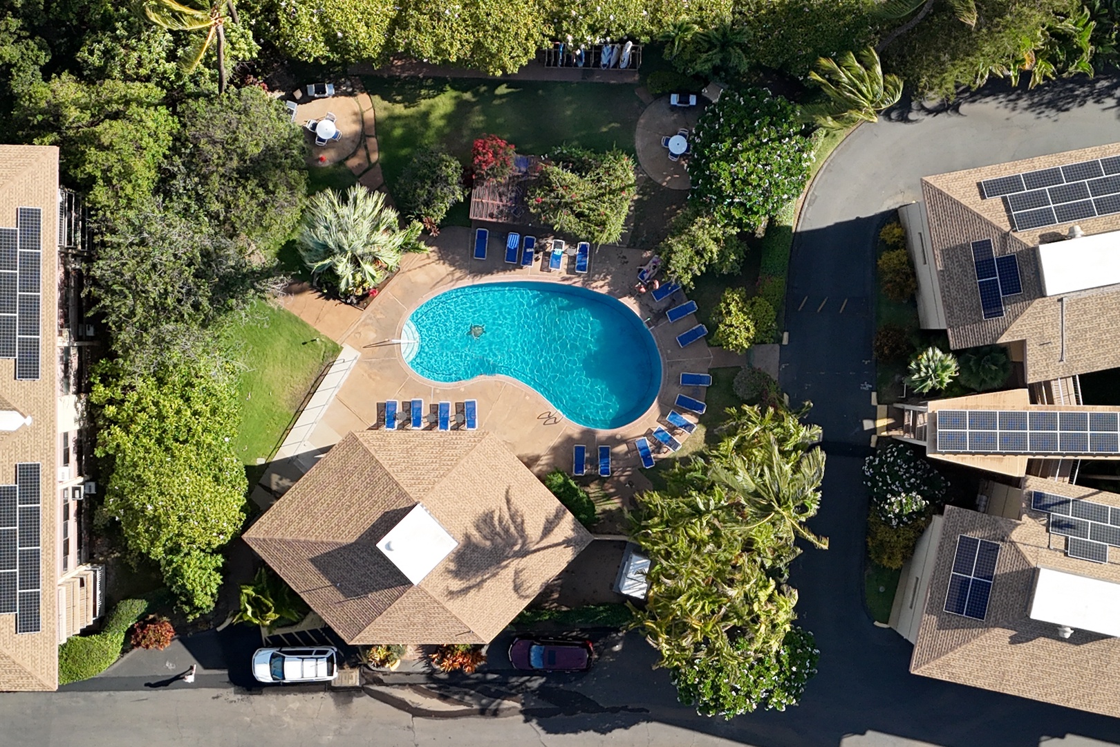 Kihei Vacation Rentals, Haleakala Shores A206 - From above, the pool courtyard reveals two more bistro tables tucked into the lawn for those who'd rather stay dry.