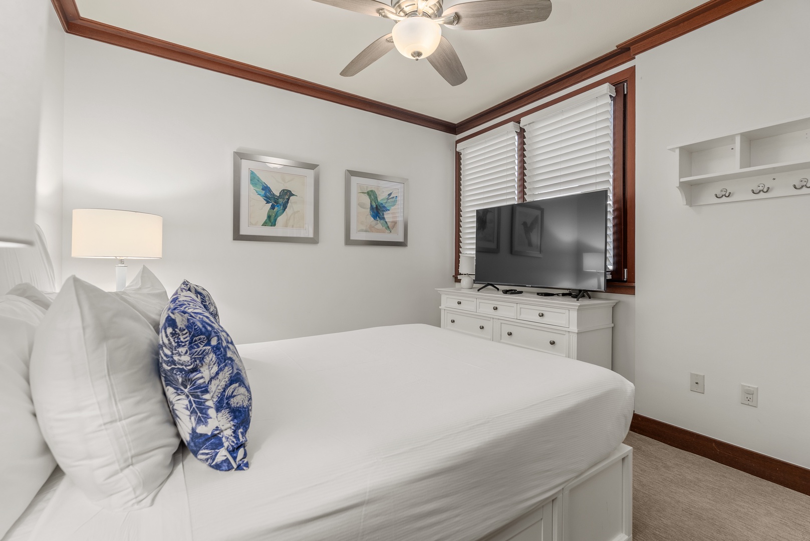 Close the shutters, cue the TV, and relax in the queen bedroom.
