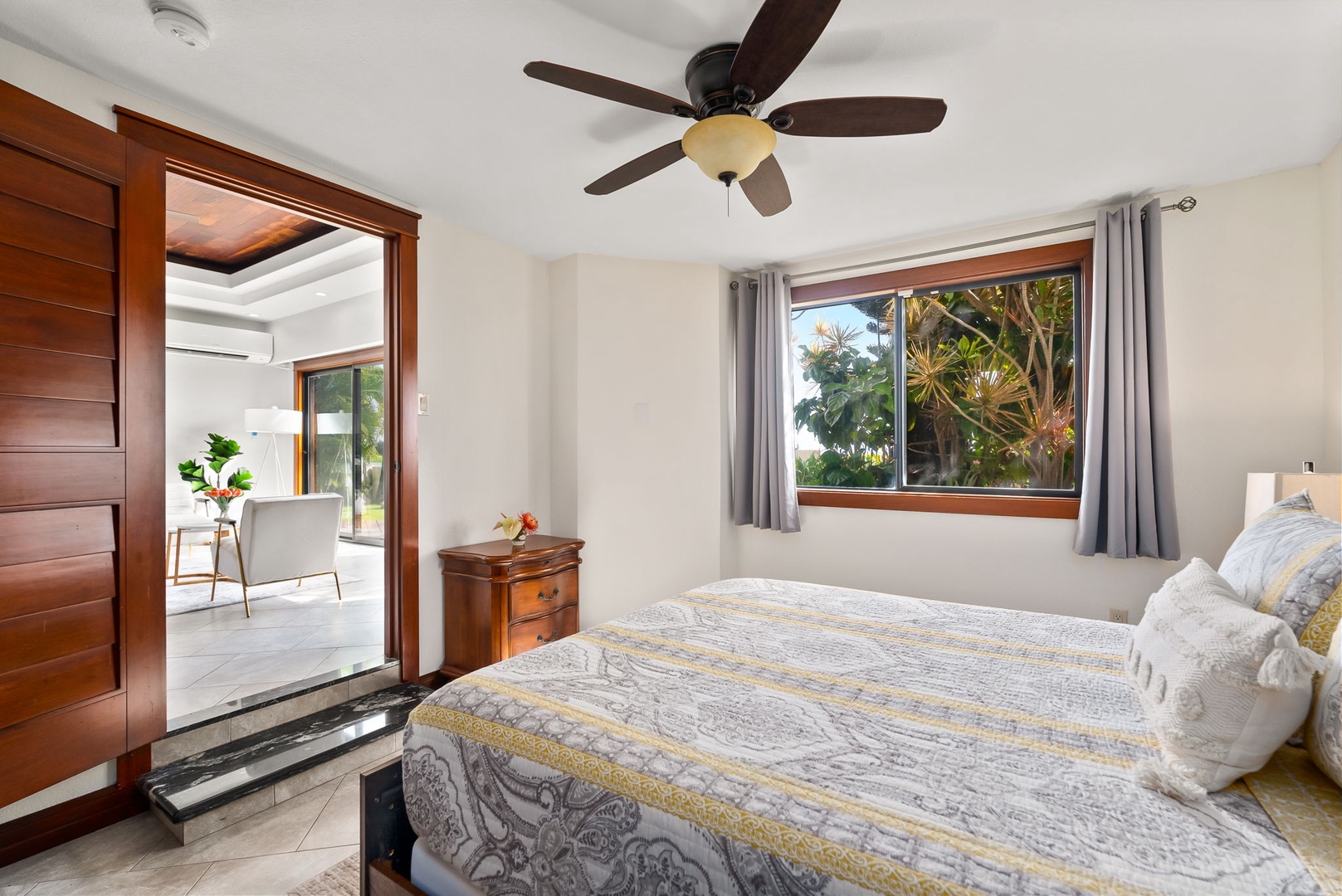 Honolulu Vacation Rentals, Wailupe Seaside 6 Bedroom - Bright and airy bedroom with a queen-sized bed and sliding doors to the outdoor space.