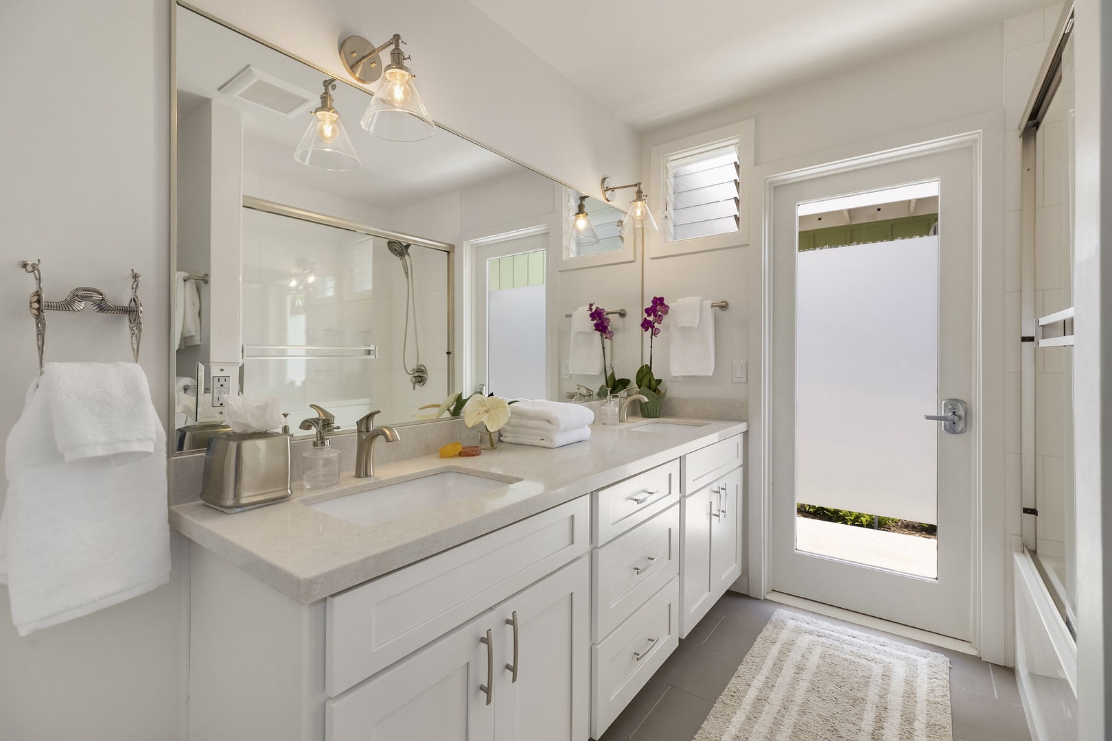 Kailua Vacation Rentals, Ranch Beach Estate - Back House Hallway Bathroom with Tub, Double Vanity, and Door to Outdoor Shower