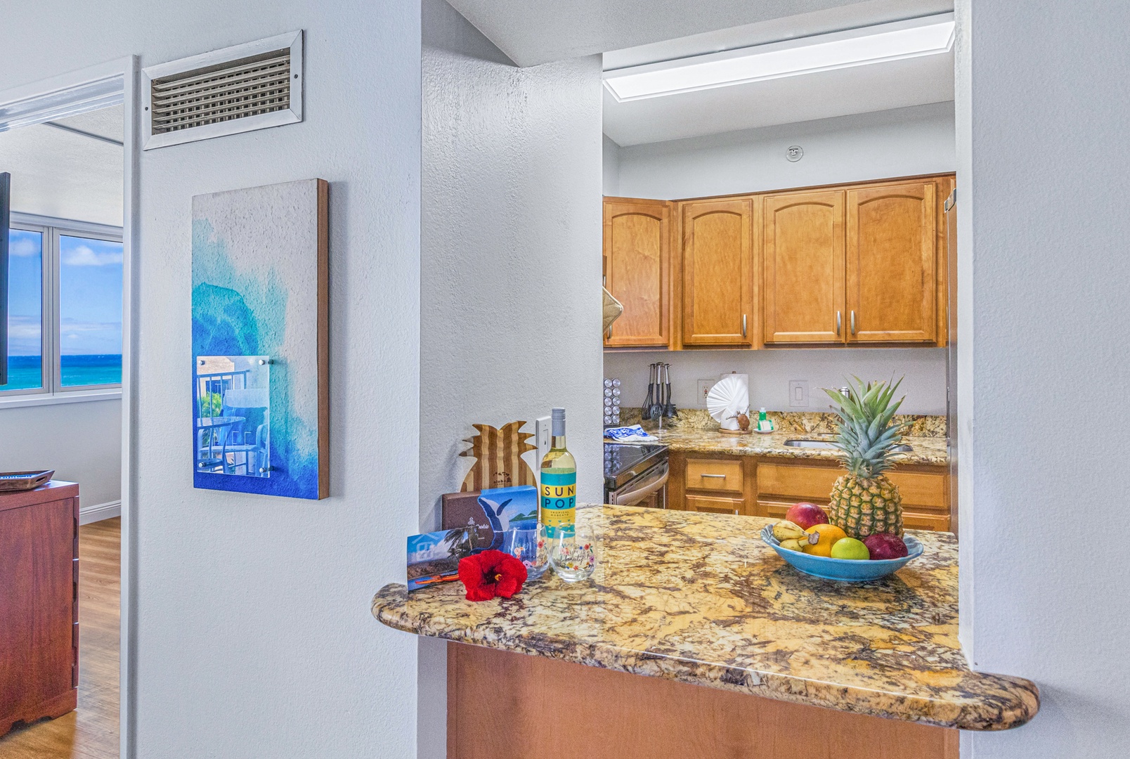 Lahaina Vacation Rentals, Royal Kahana 213 - The granite breakfast bar at Royal Kahana 213 is perfect for a quick snack or drink with tropical charm.