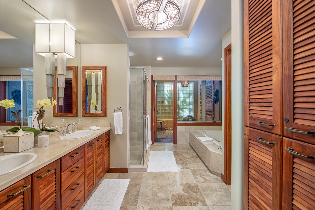 Kailua Kona Vacation Rentals, 2BD Hillside Villa (4102) at Hualalai Resort - The en-suite primary bathroom offers dual sinks, a walk-in shower, a soaking tub, and a sizable outdoor shower garden, allowing you to indulge in a spa-like experience in the privacy of your own villa.