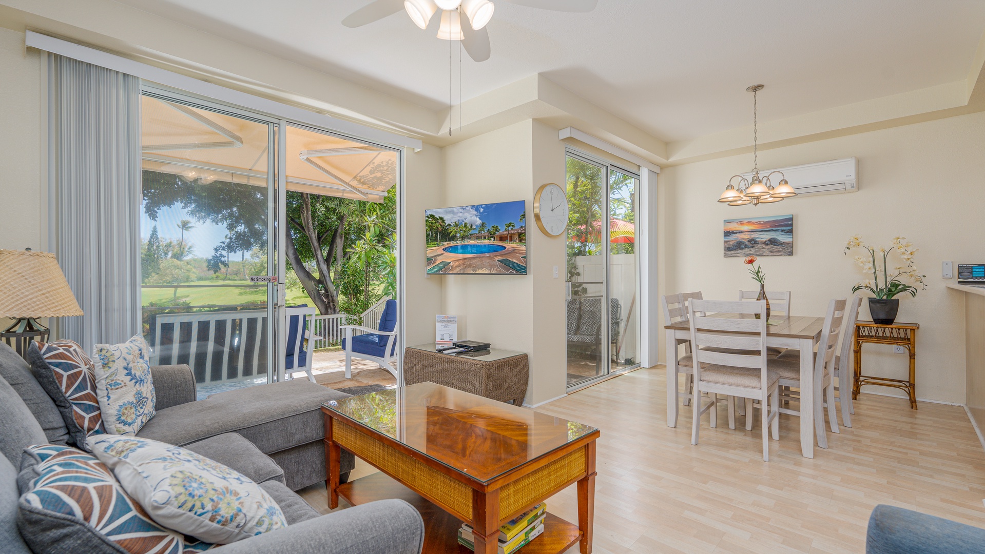 Kapolei Vacation Rentals, Fairways at Ko Olina 18C - The dining area includes an air conditioner above the dining table and sliding glass doors leading to the patio.