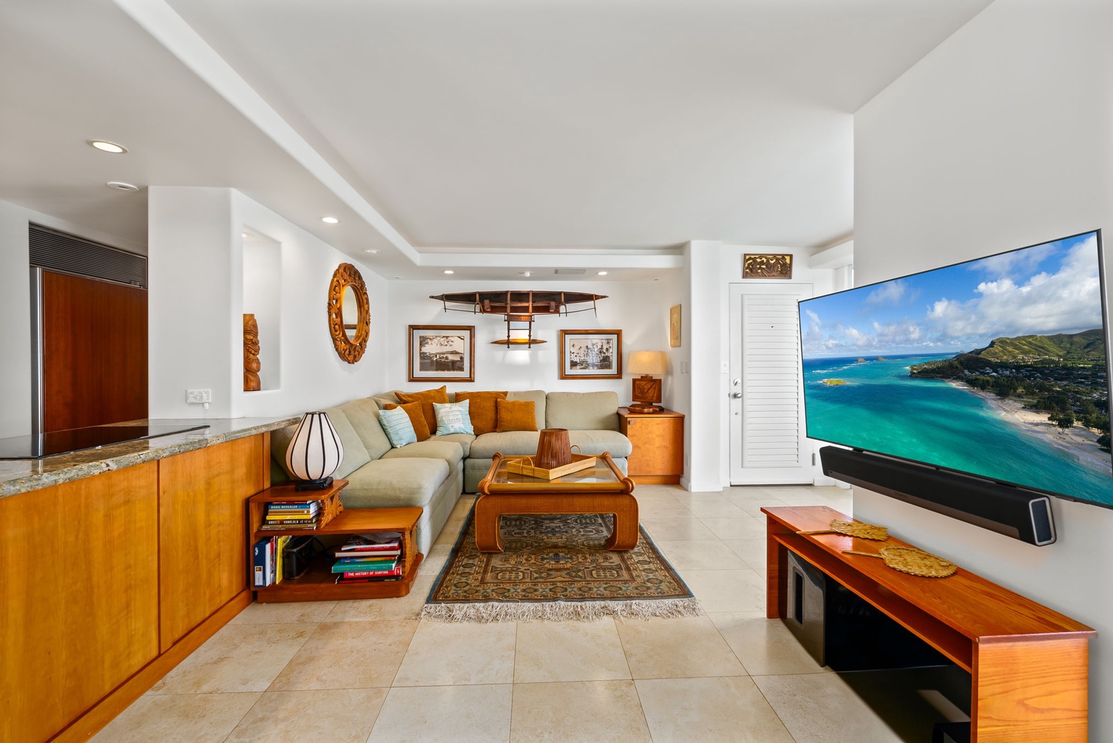 Honolulu Vacation Rentals, Kaimana Beach Penthouse - Comfortable living room with plush seating and coastal decor, offering an ideal space to unwind after a day in paradise.