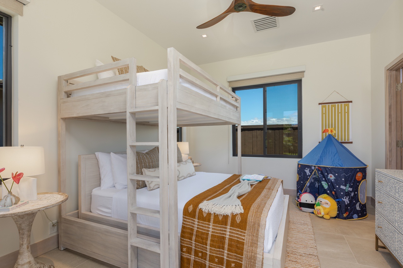 Waimea Vacation Rentals, 5BD Mauna Lani Lux Golf Estate (4) at One Ocean - This charming bedroom is thoughtfully designed for comfort and space efficiency, featuring a stylish bunk bed that maximizes the sleeping area, making it ideal for children or guests.