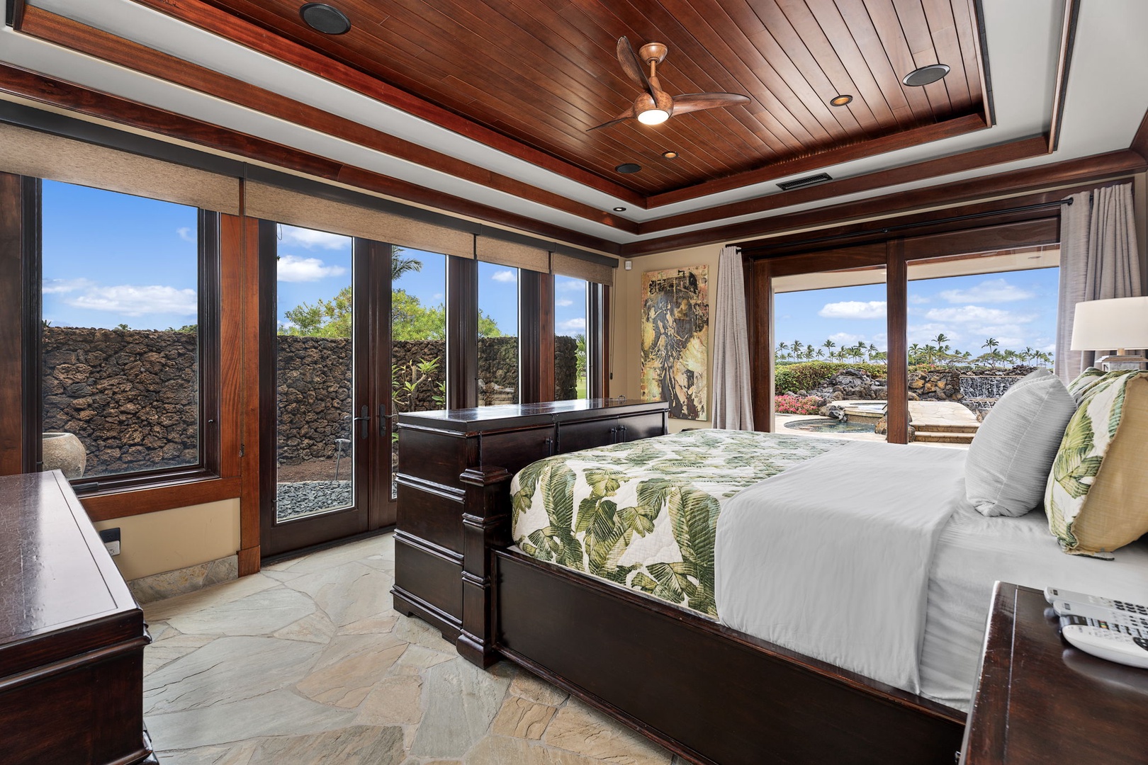 Kamuela Vacation Rentals, Hale Konane - Wake to lush views in this inviting suite, complete with floor-to-ceiling windows and stone flooring.
