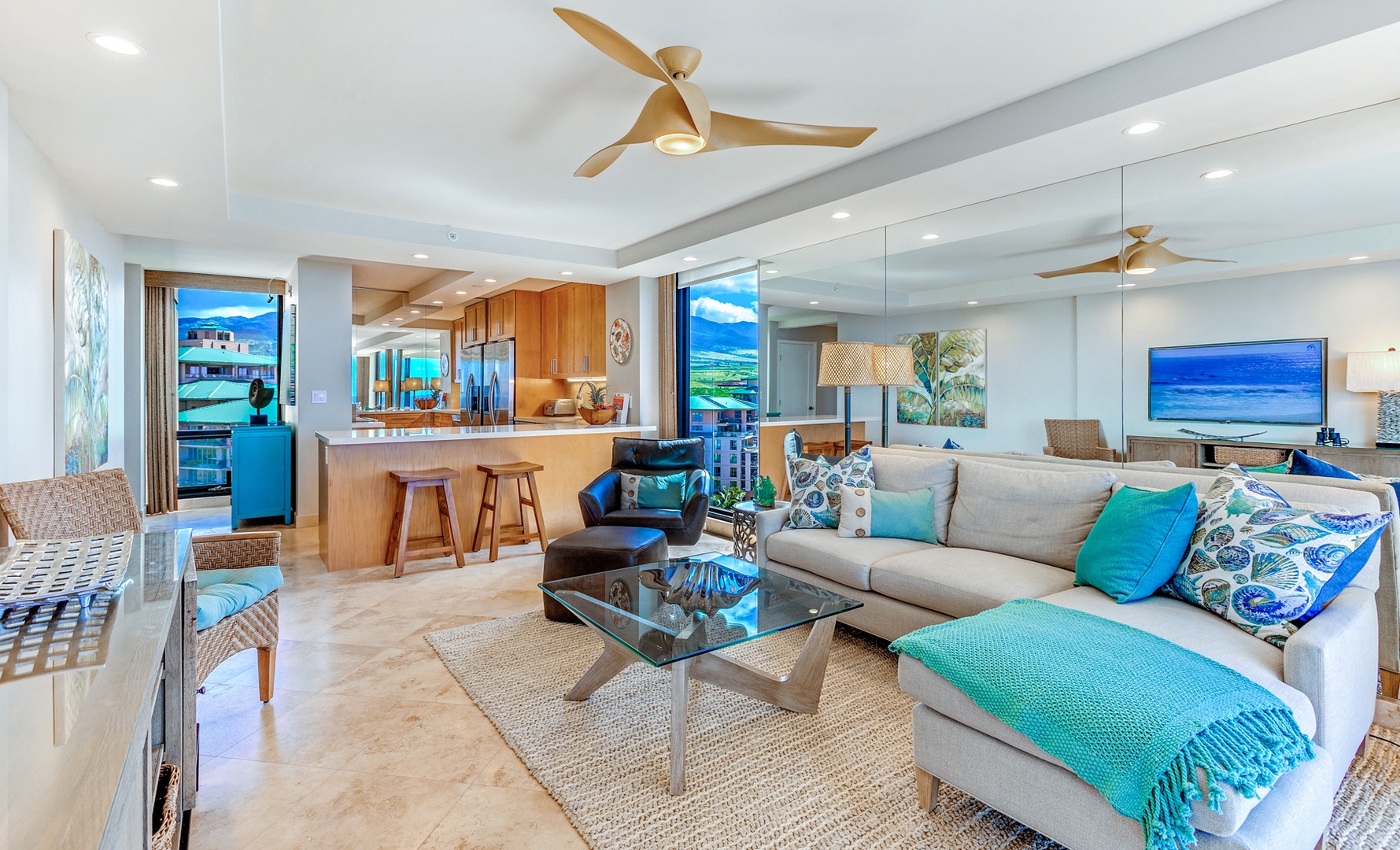 Lahaina Vacation Rentals, Mahana 1119 - The living area offers plush sectional sofa and open floorplan to the kitchen for seamless flow and connection.