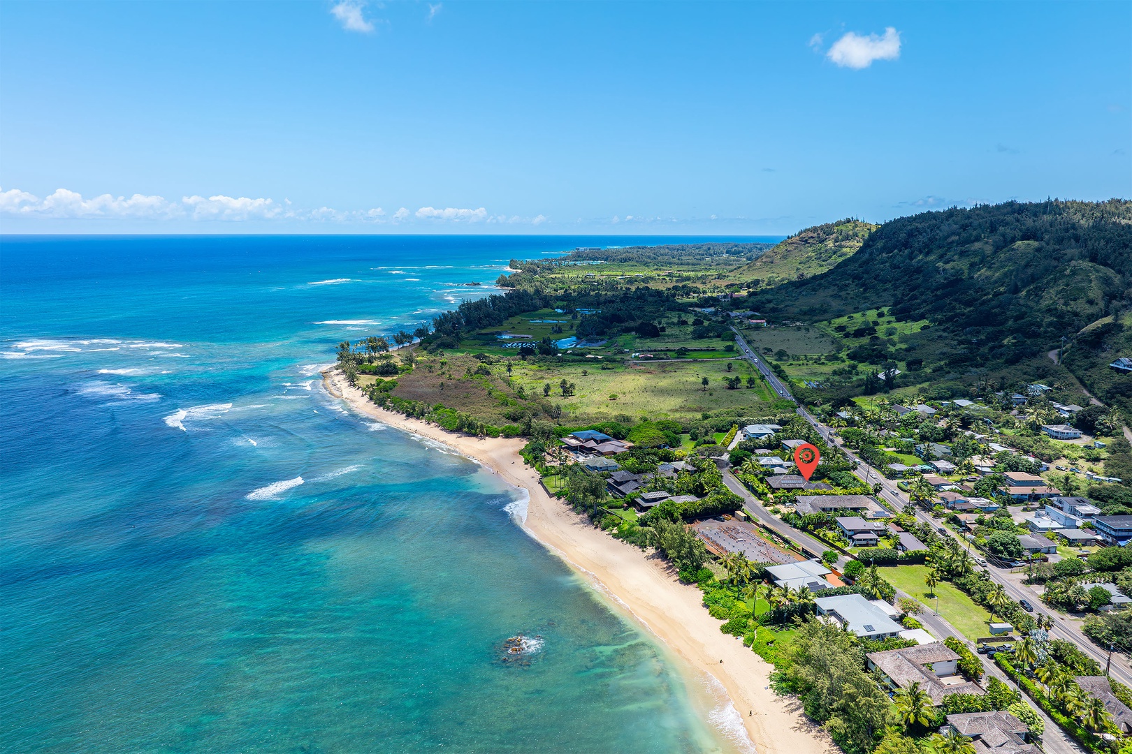 Haleiwa Vacation Rentals, Kaunala Retreat - Drone view down the coast showcasing the stunning North Shore curve and endless beachline.