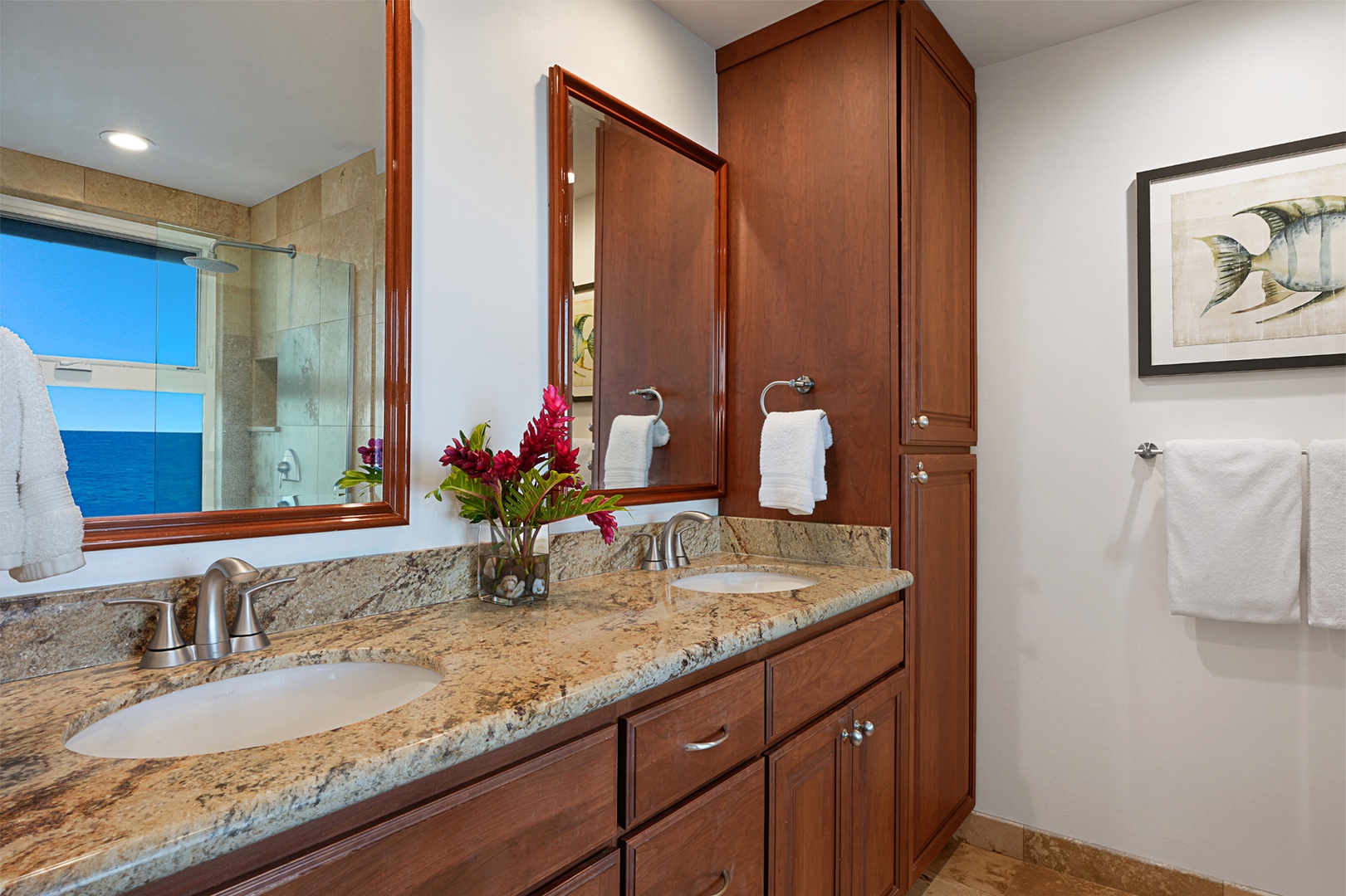 Koloa Vacation Rentals, Whalers Cove #133 - Elegant bathroom with dual sinks, granite countertops, and a walk-in shower.