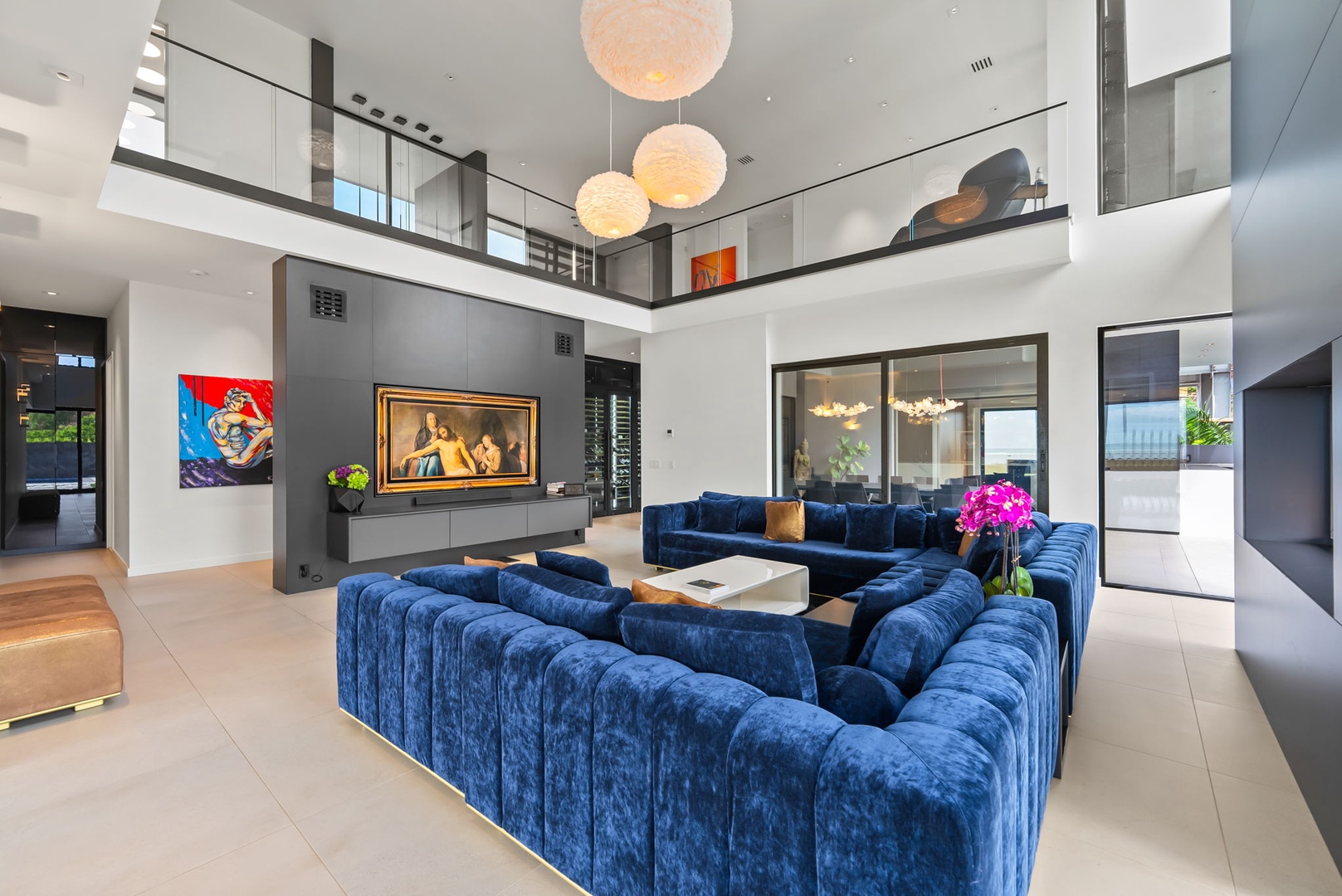 Honolulu Vacation Rentals, Ocean Villa 3 Bedroom - A calm and airy two-story living space with sculptural lighting and rich velvet seating.