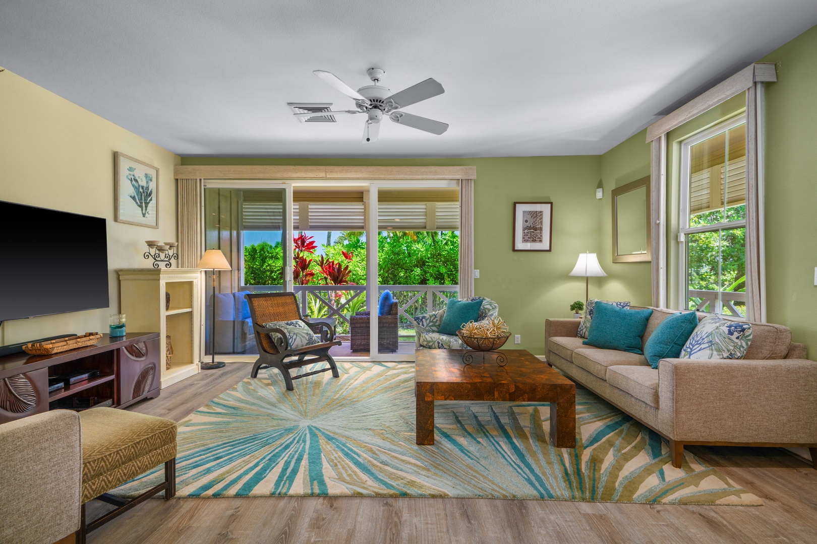 Princeville Vacation Rentals, Kaimana Villa - Unwind in your bright living space where tropical views meet comfortable seating and vibrant décor.