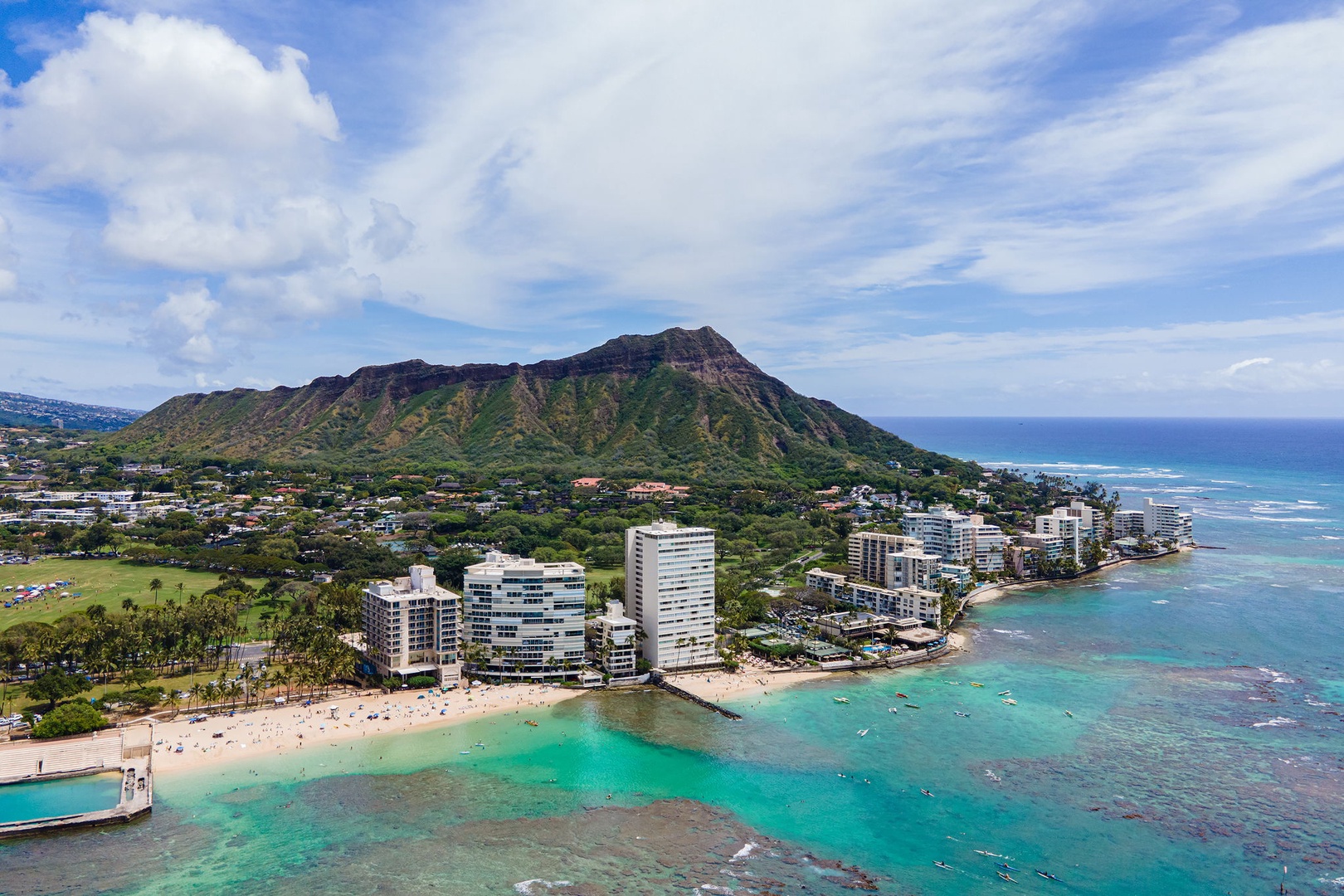Honolulu Vacation Rentals, Colony Surf Getaway - Stunning aerial view encompassing lush landscapes and crystalline waters for a truly majestic Diamond Head setting.