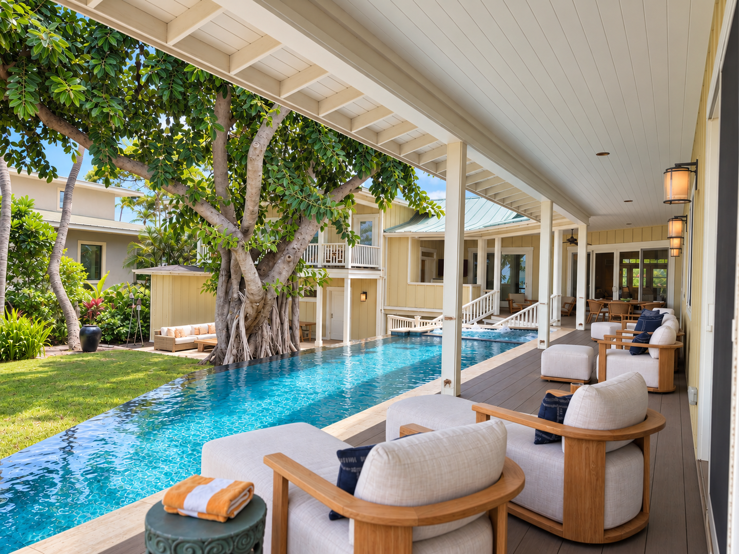 Kamuela Vacation Rentals, 4BD Estate Home at Puako Bay (74) - Banyan shade falls over the poolside sofas, the house and cottage rising just past the water.