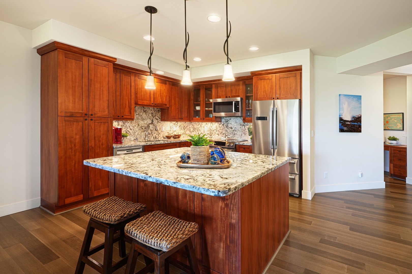 Koloa Vacation Rentals, Pili Mai 6J - Your gourmet kitchen awaits with rich cherry cabinets, granite countertops, and stainless steel appliances—perfect for creating memorable meals together.