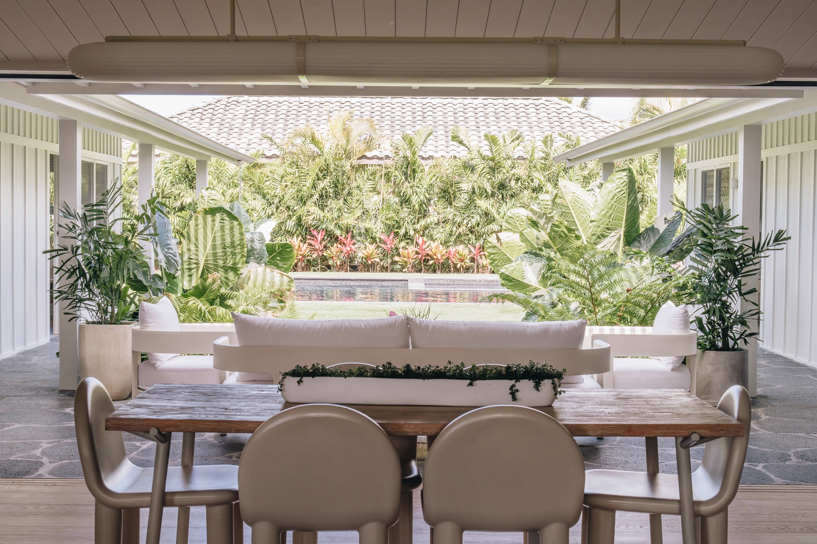 Honolulu Vacation Rentals, Surfside Bungalow** - Gather for relaxed meals and conversation in this shaded outdoor dining space.