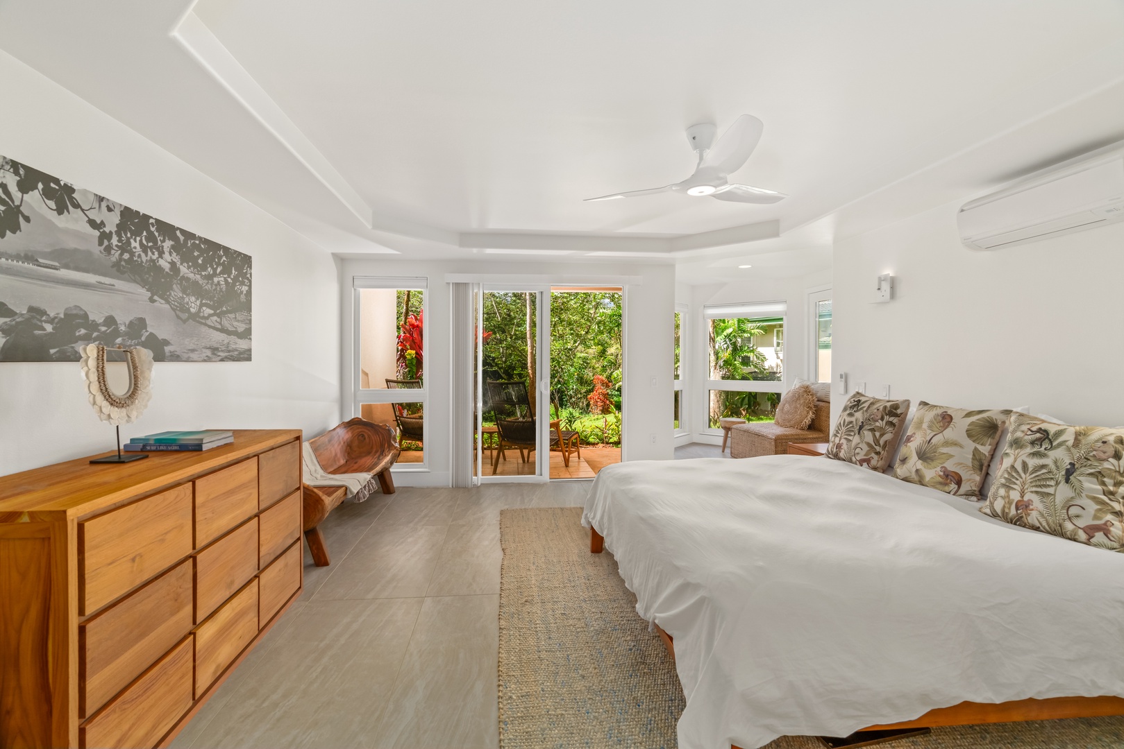 Princeville Vacation Rentals, Mana Wahine - Primary suite with King bed, private lanai, and plenty of natural light.