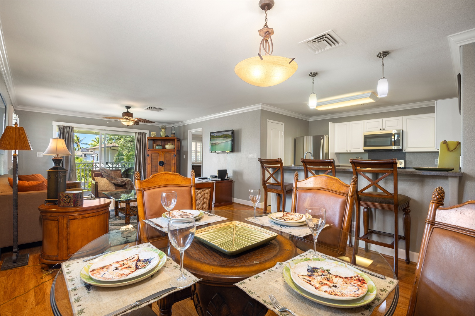 Your elegant dining space awaits with rich wood furnishings and a fully-equipped kitchen, perfect for memorable meals together.