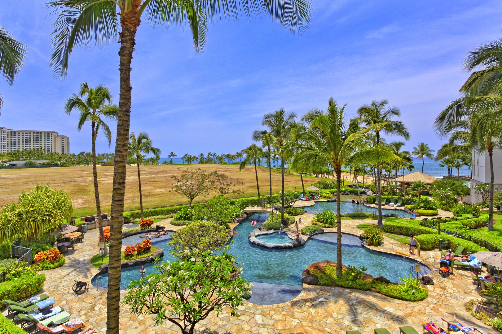 Kapolei Vacation Rentals, Ko Olina Beach Villas B706 - The lagoon pool surrounded by palm trees.