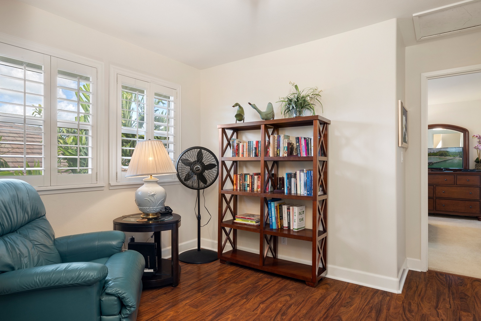 Curl up with your favorite book in this cozy reading nook, where soft lighting and comfortable seating create the perfect escape.