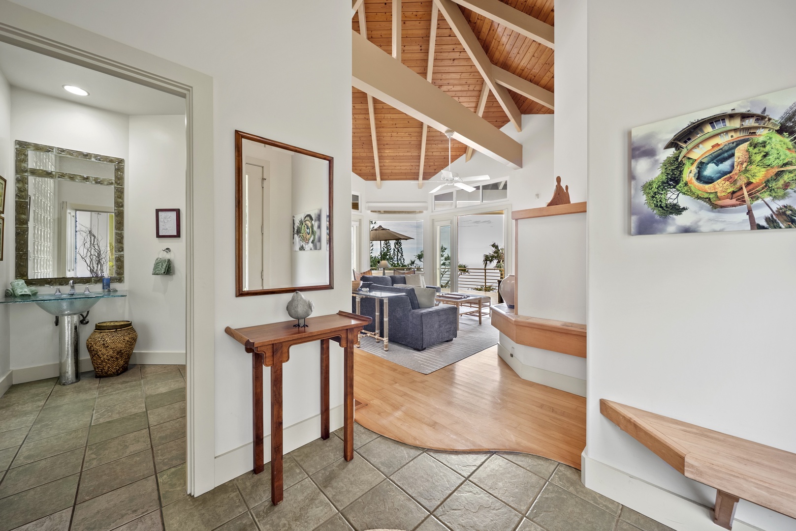 Haleiwa Vacation Rentals, Ka Hale Hau'oli - The stunning open-plan retreat with soaring wooden ceilings, warm hardwood floors, and an elegant spiral staircase.