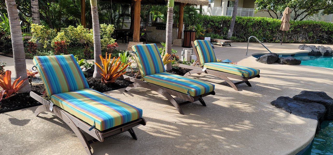 Stretch out on vibrant poolside loungers surrounded by tropical gardens—your perfect spot to soak up the sun and unwind by crystal-clear waters.