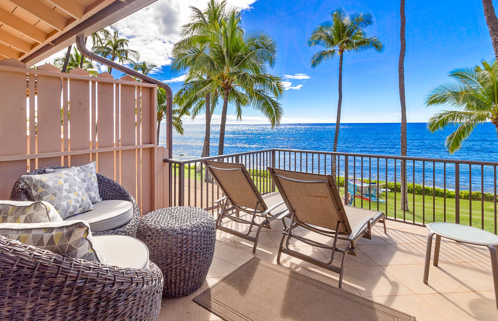 Lahaina Vacation Rentals, Puamana 240-3 - Relax in a private lounge area with stunning views of the ocean and a tropical breeze.