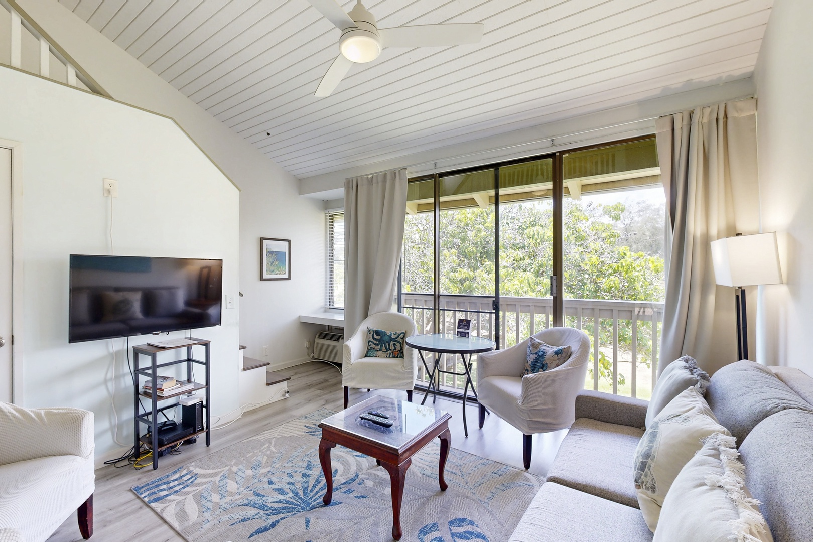 Kahuku Vacation Rentals, Kuilima Estates West #132 - Bright living room with vaulted ceiling and natural light.