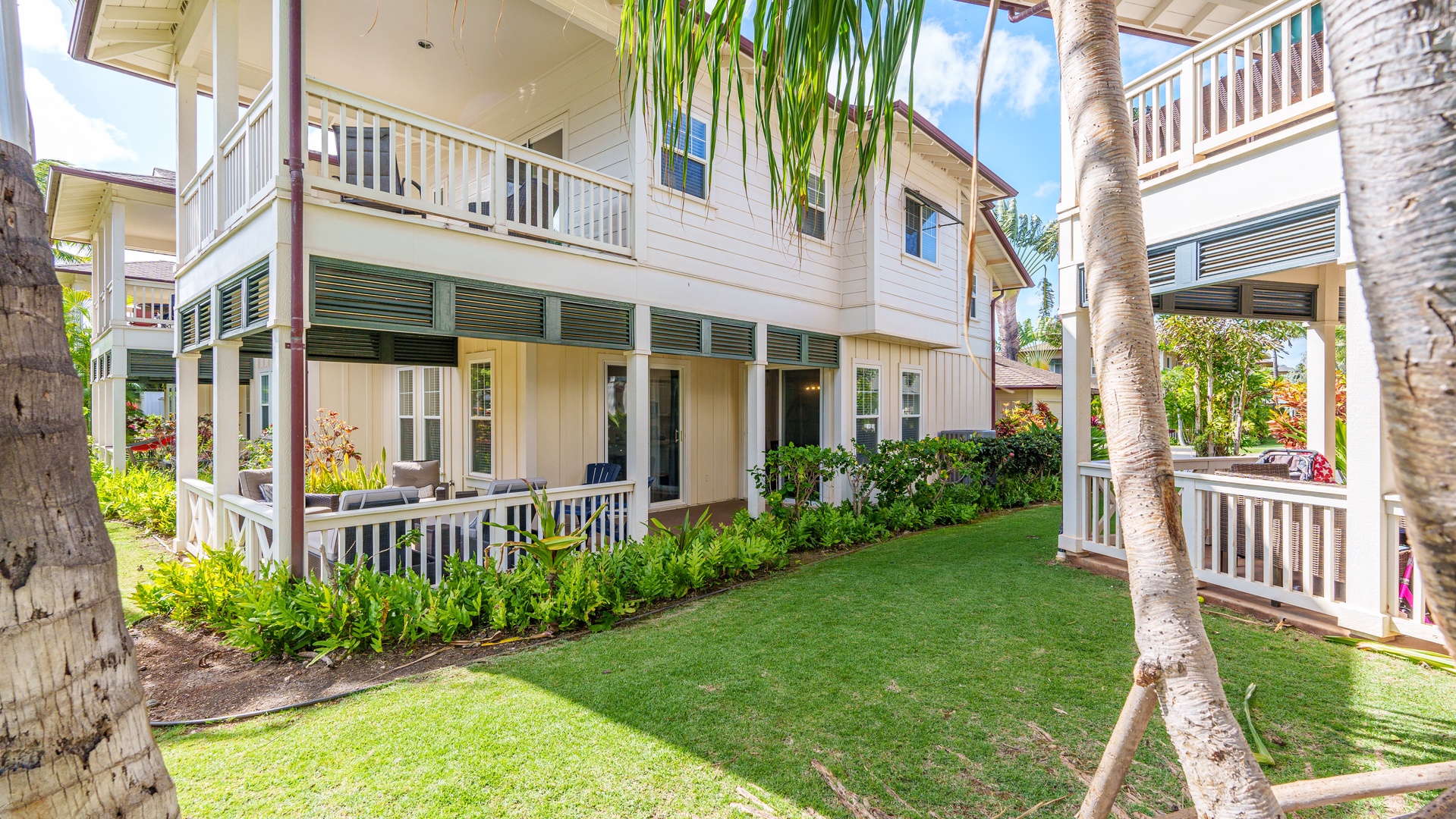 Kapolei Vacation Rentals, Coconut Plantation 1078-1 - A sweet view of the lanai and the yard on your vacation.