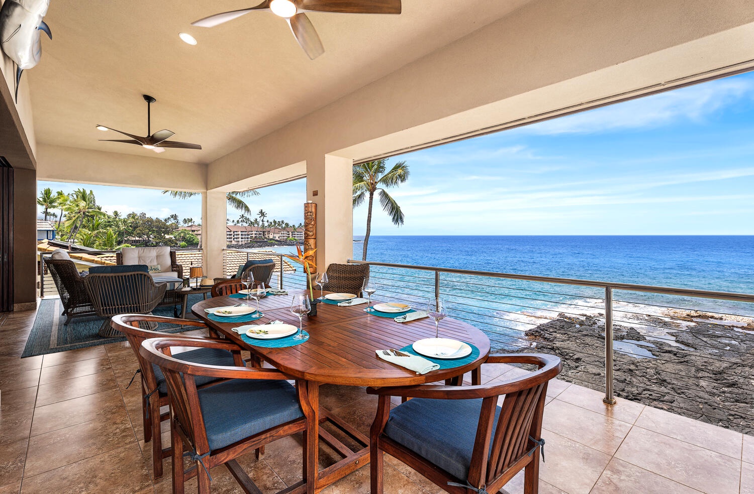 Kailua Kona Vacation Rentals, Kailani Vista - Teak dining table invites lingering over grilled ono and local pineapple as palm fronds frame the horizon.