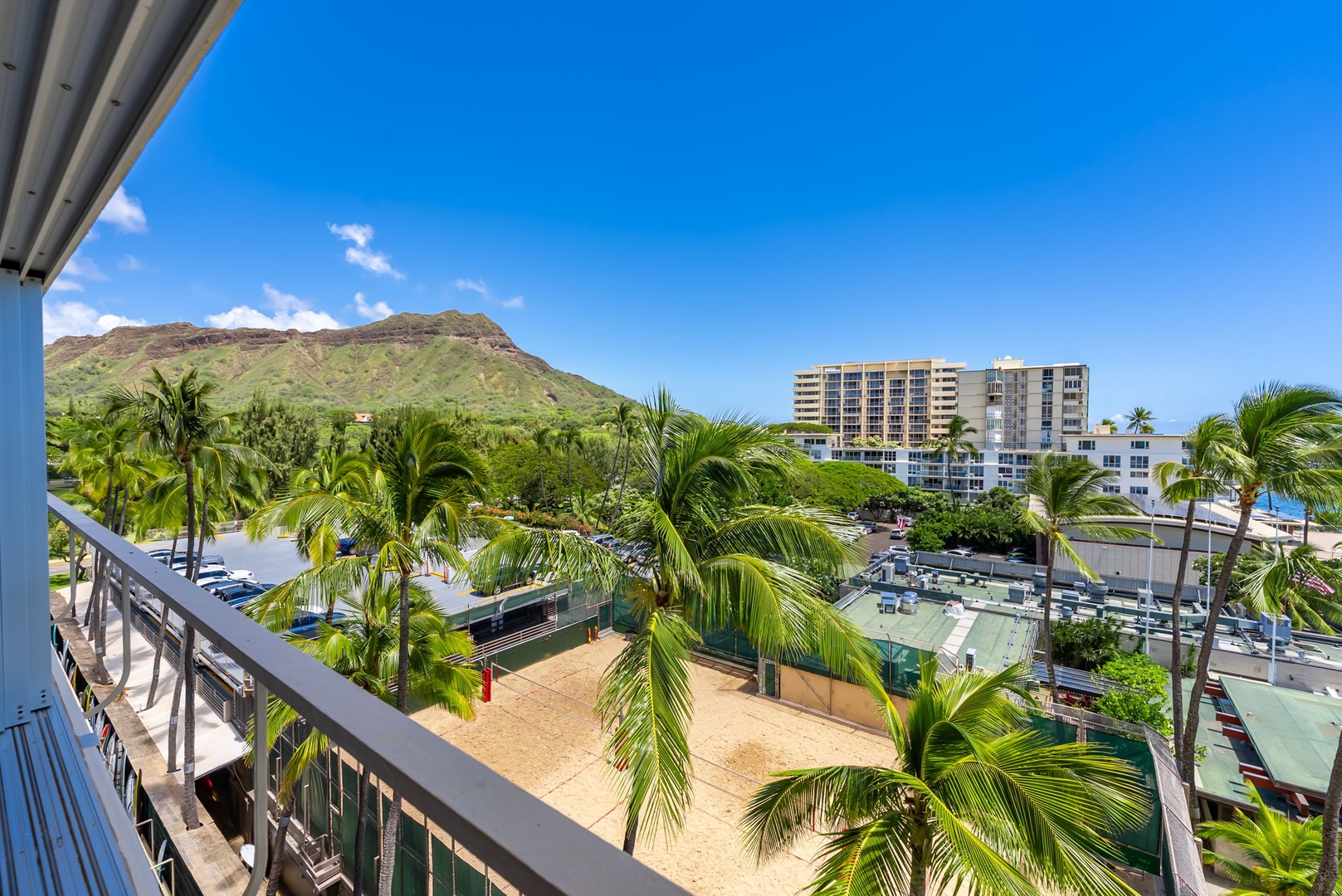 Honolulu Vacation Rentals, Colony Surf Retreat - Treetop balcony views with Diamond Head peeking in the distance—perfect for sunrise coffee or sunset cocktails.