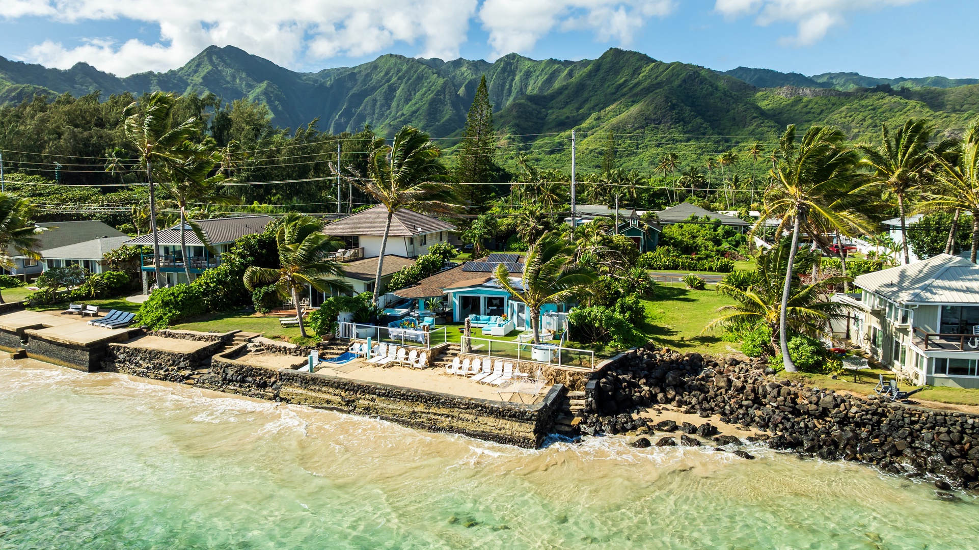 Hauula Vacation Rentals, Private Beach Paradise - Beachfront home set along the shoreline with mountain views and tropical surroundings.