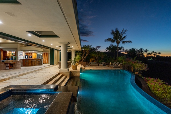 Kamuela Vacation Rentals, Canoe House & Beach Walker at Champion Ridge - Beautifully lit infinity pool and outdoor area at night, providing a serene space for evening relaxation.