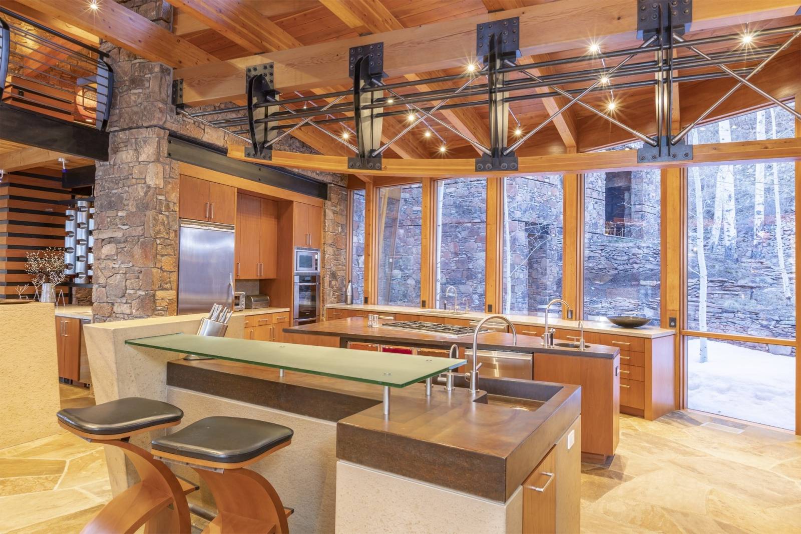 Telluride Vacation Rentals, PaGomo* - The stone components of the property were harvested from the 70-acre lot and provide an indigenous atmosphere, with cutting edge design and use of materials.